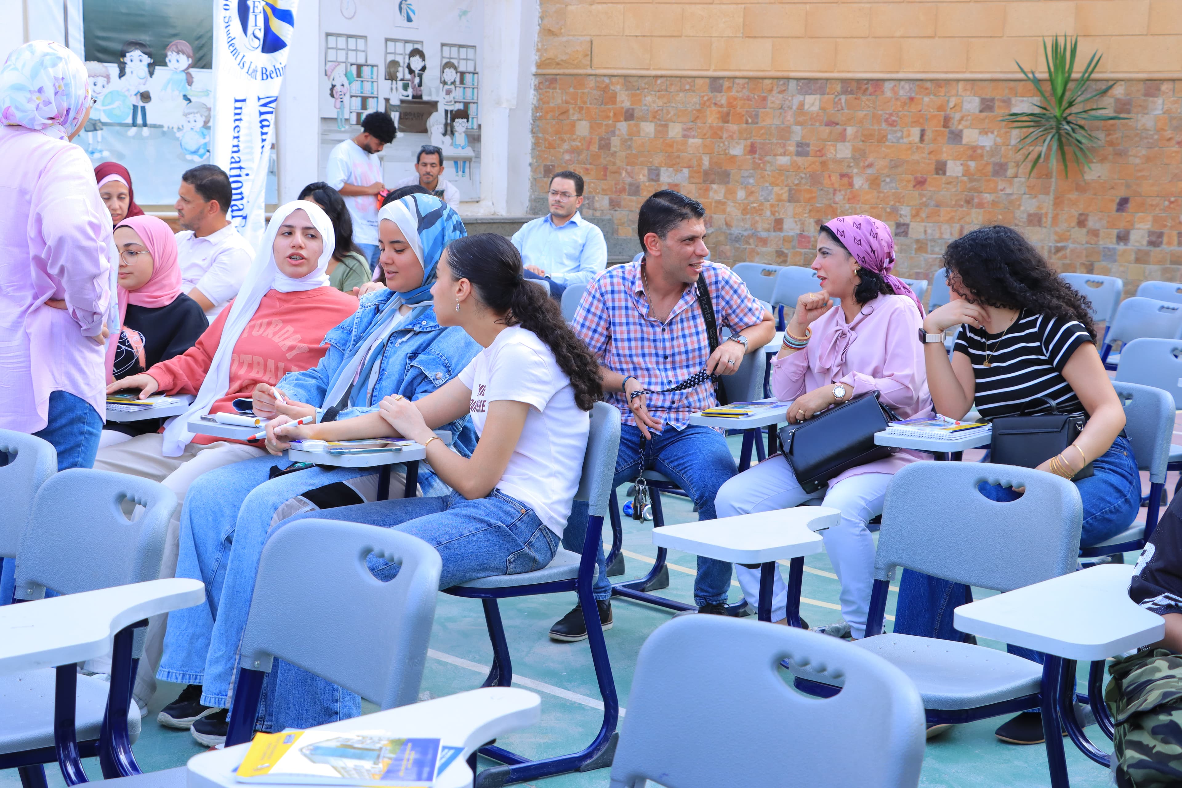 Parents and students at a MEIS school session