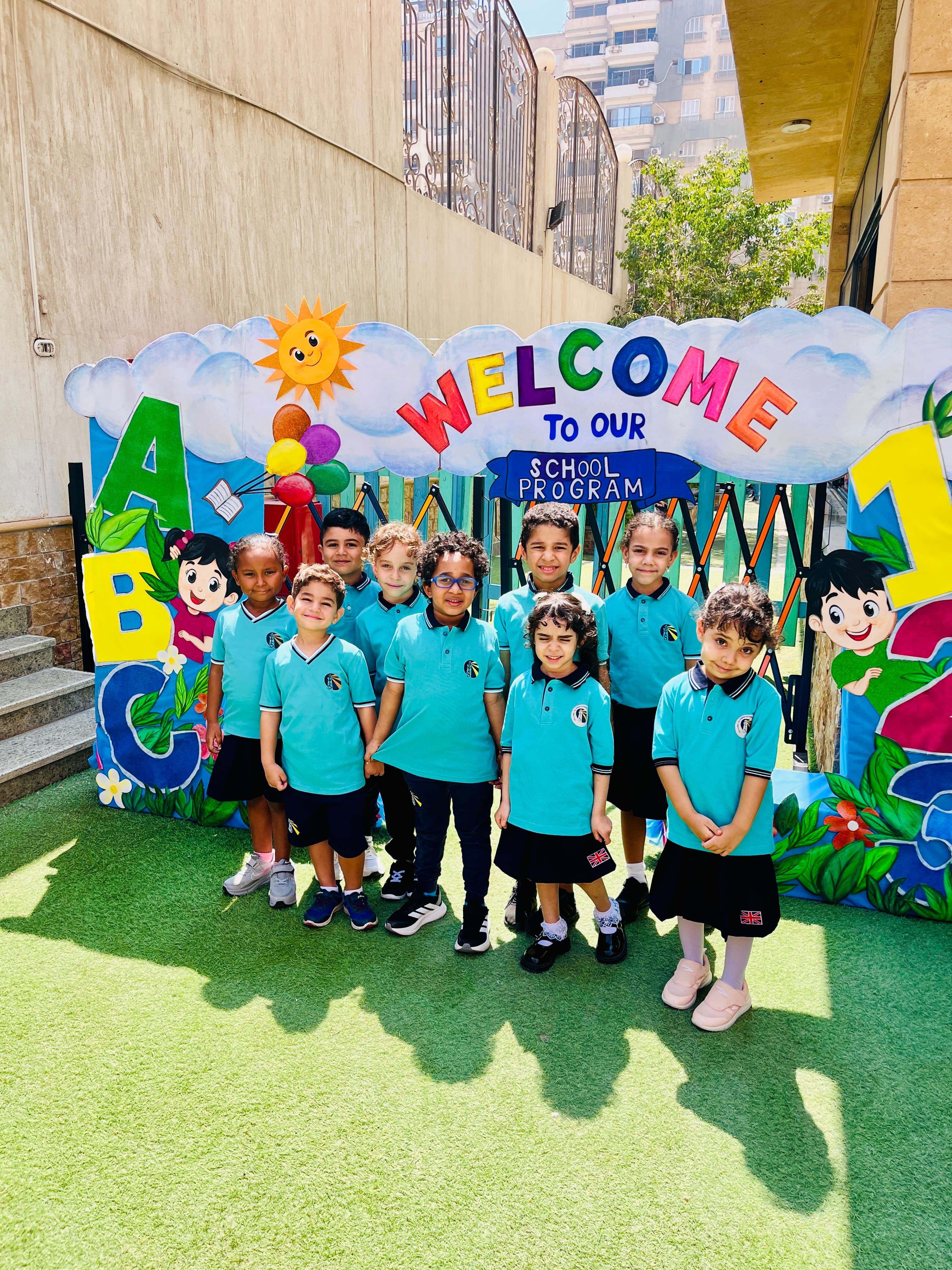 Young students at the school’s welcome arch