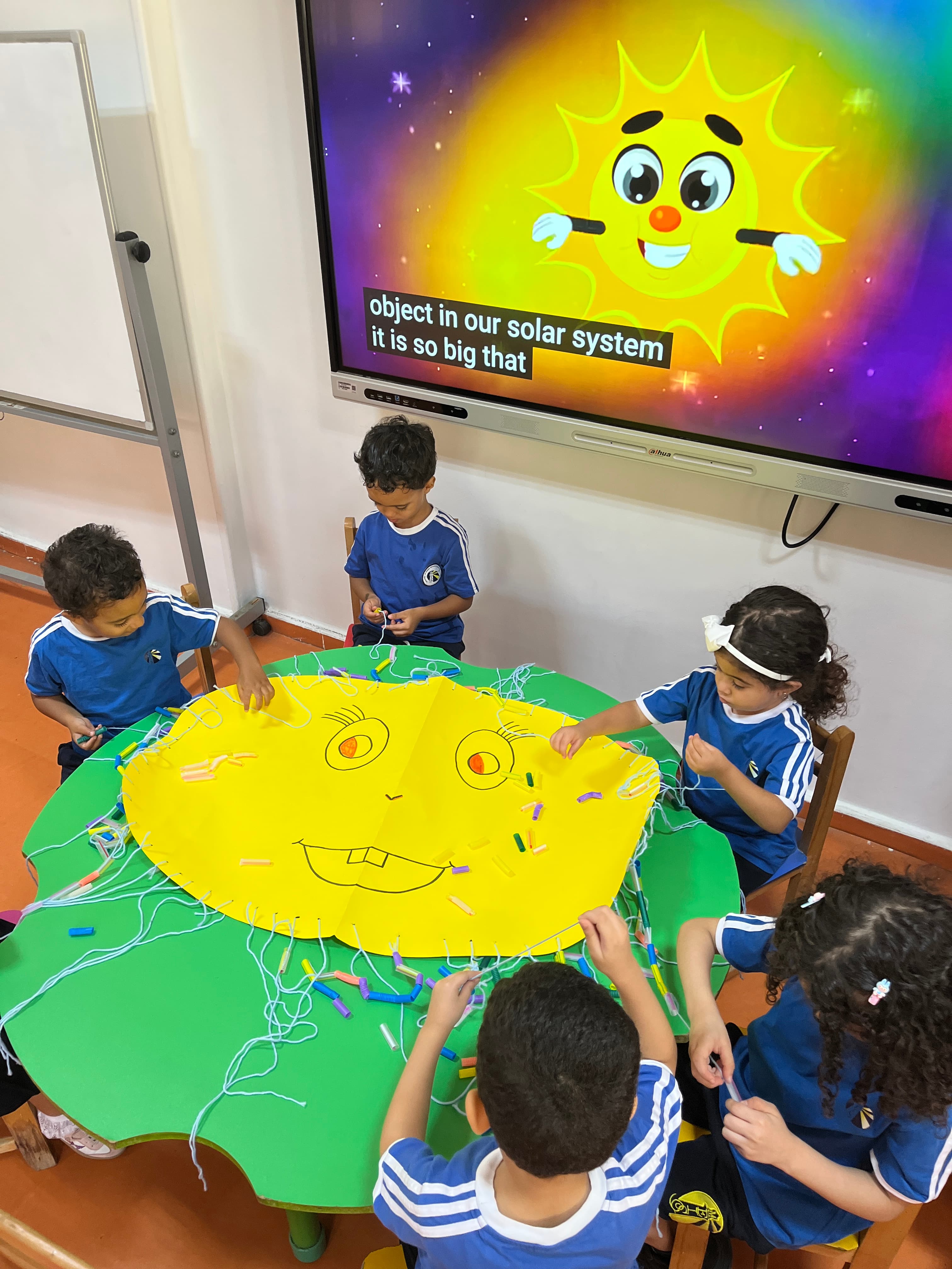 Young students making a craft together
