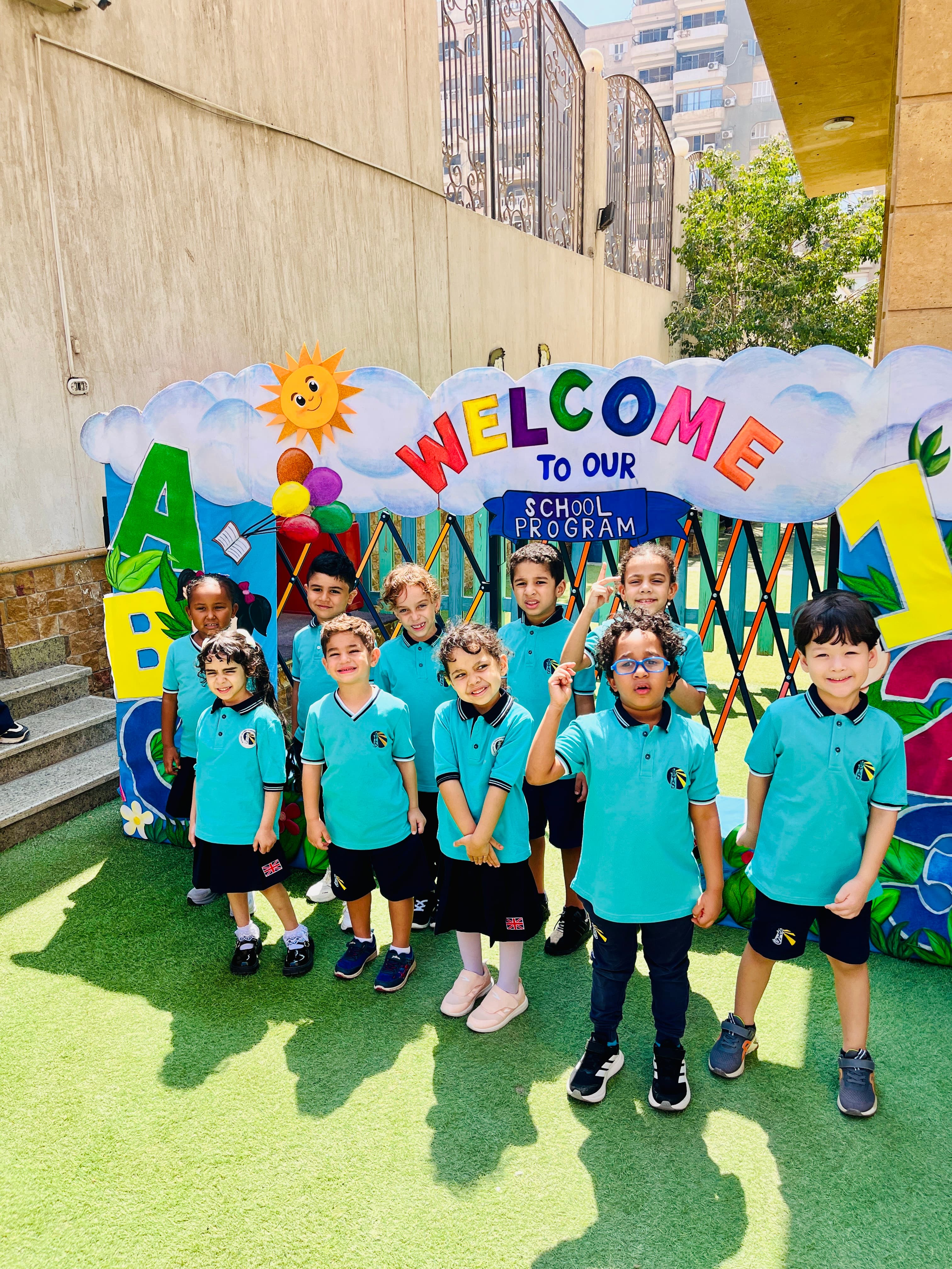 Young students at the school’s welcome arch