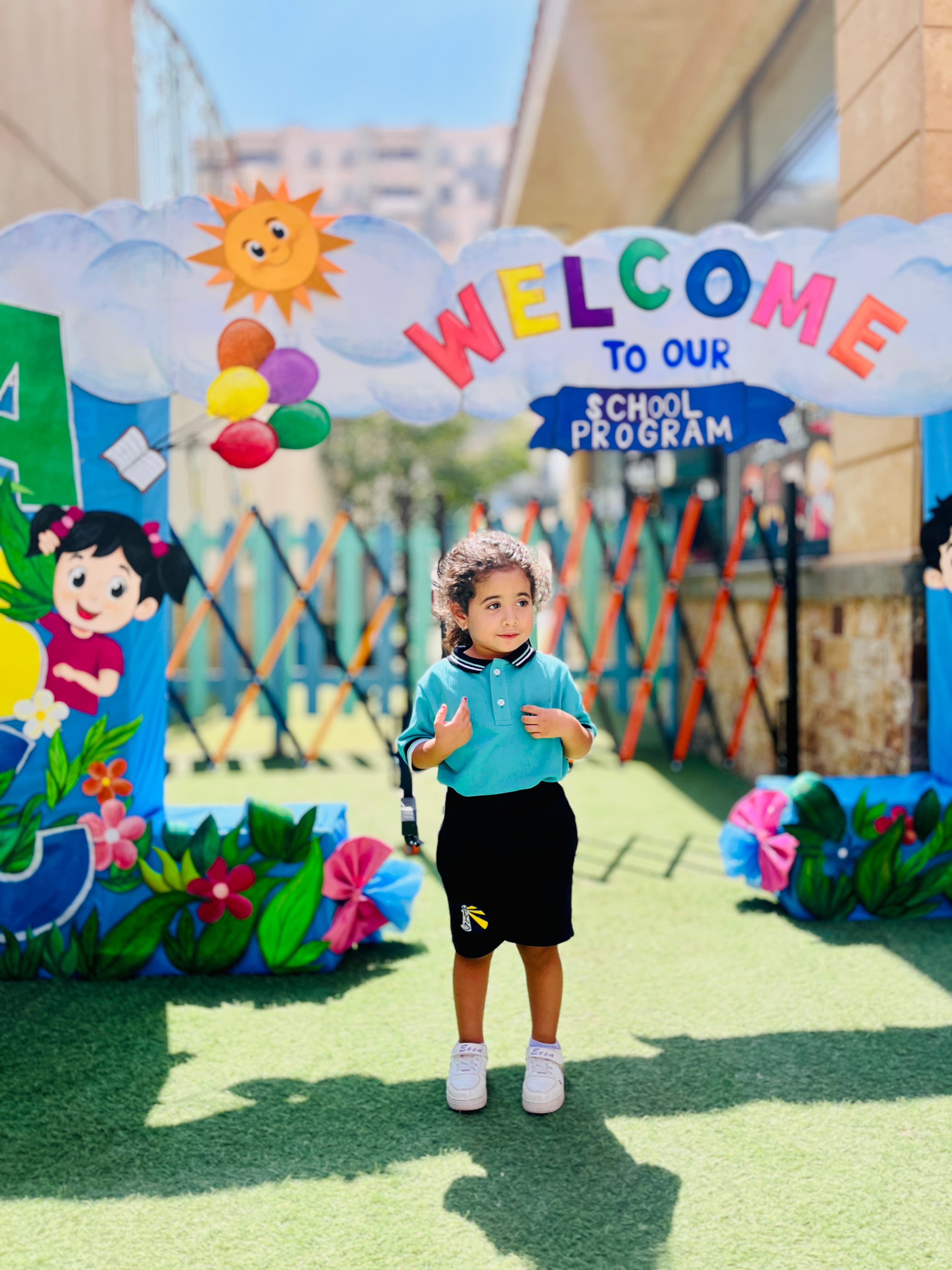 A young student under the welcome arch