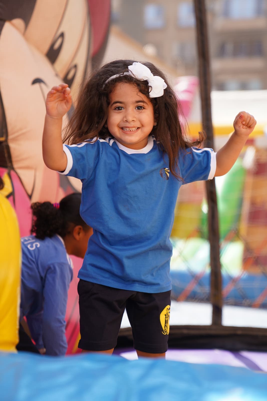 A student cheering at a fun day