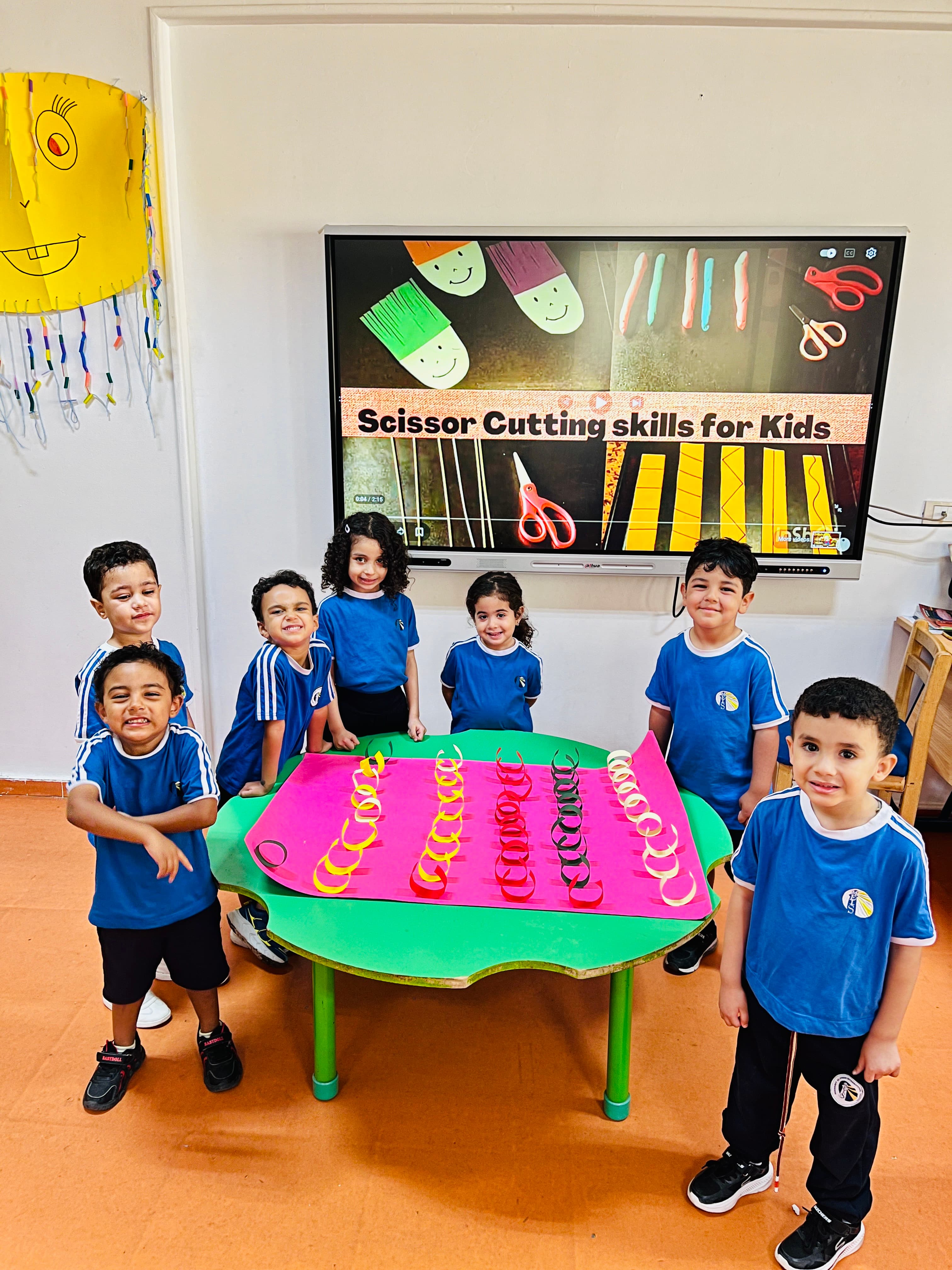Students around a paper-chain table