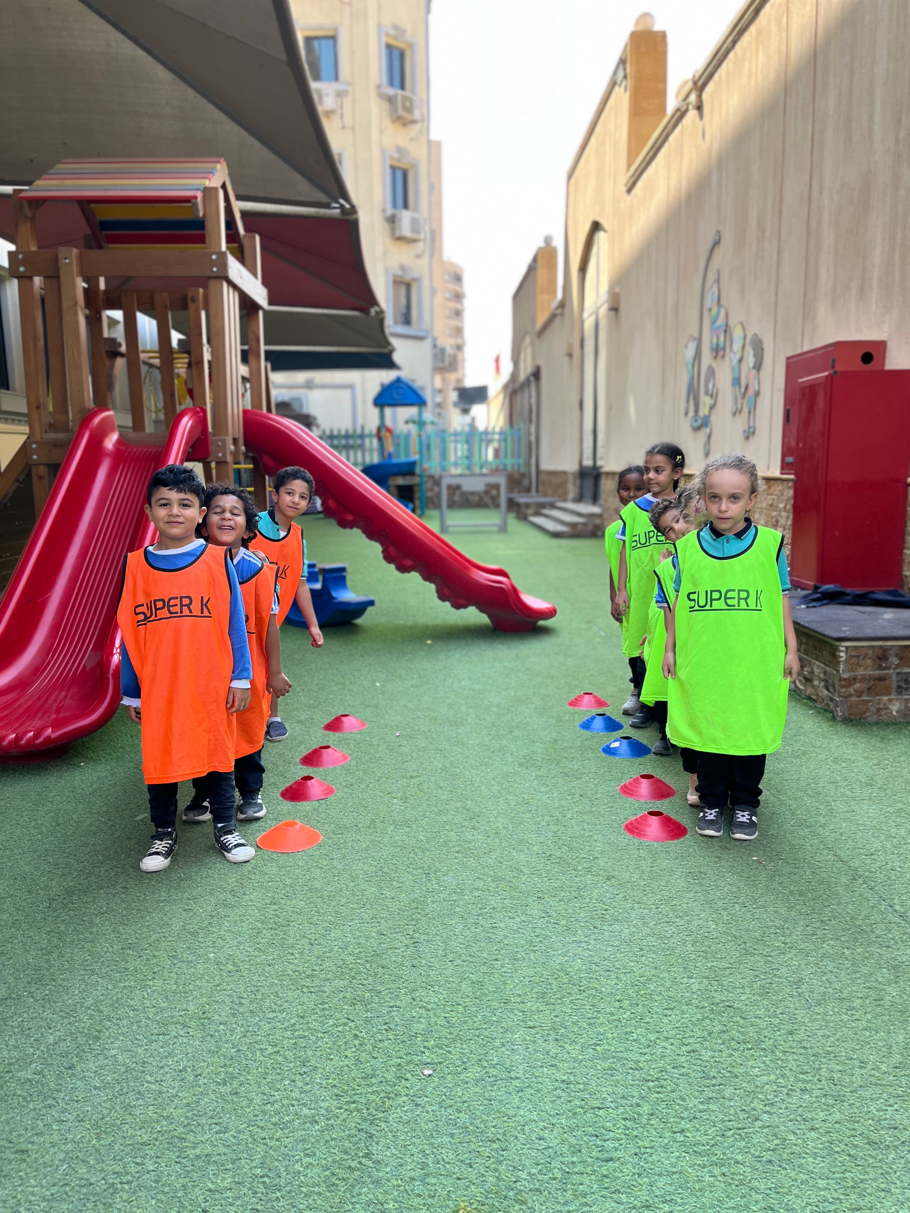 Young students in sports bibs